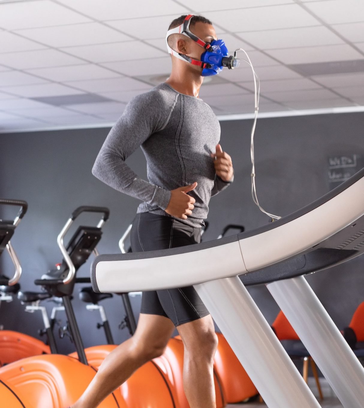 A man  in grey on a treadmill